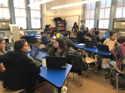 NYC iSCHOOL: The students of the Mock Election module working on their campaign strategy.