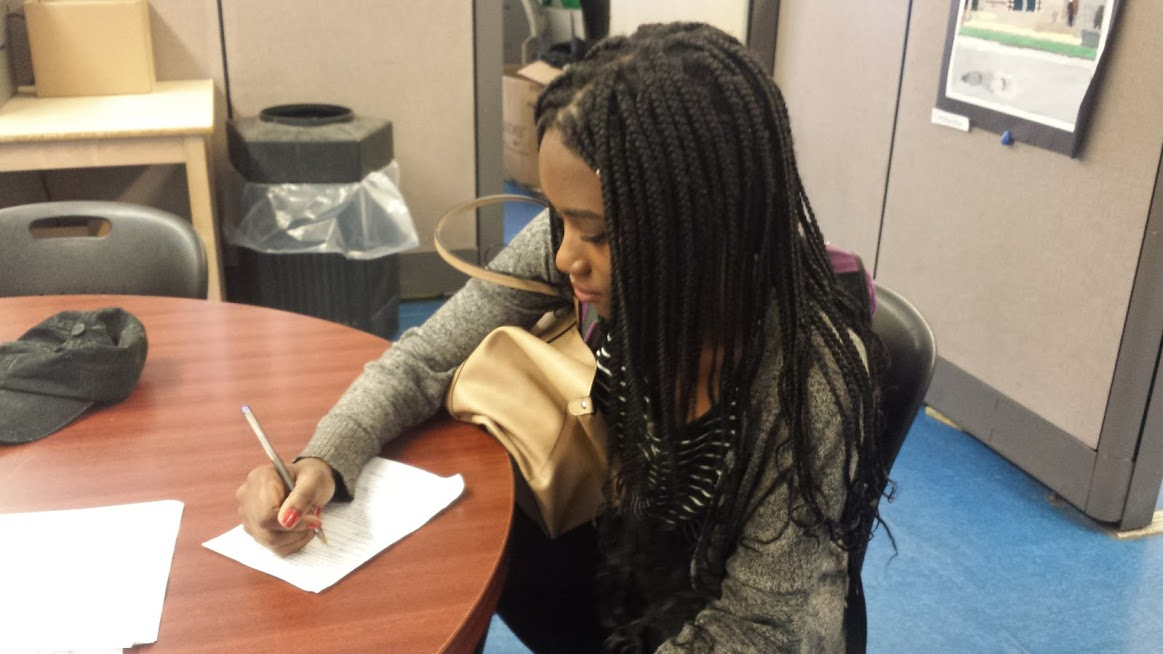 NYC iSchool Sophomore Dianney Mascary filling out an AP US History application.