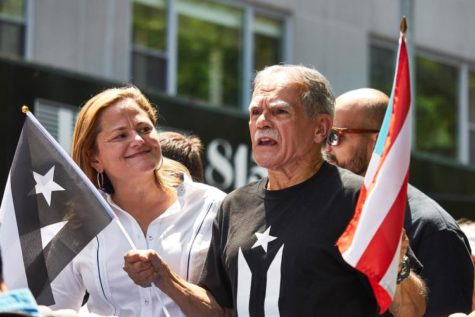 Oscar Lopez Rivera with City Council Speaker Melissa Mark-Viverito on the lead float at this year's Puerto Rican Day Parade.