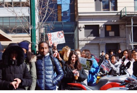 Students at the NYC iSchool hold signs and chant for change.