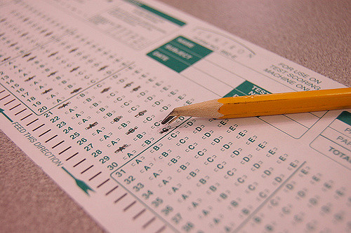 A bubble sheet for standardized testing alongside a pencil, photo courtesy of Josh Davis.