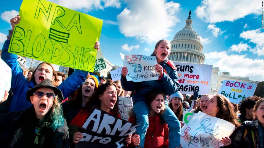 Students participate in a rally with other students from DC, Maryland and Virginia in their Solidarity Walk-Out to urge Republican leaders in Congress to allow votes on gun violence prevention legislation. on Capitol Hill in Washington, DC, March 14, 2018.
Students across the US walked out of classes on March 14, in a nationwide call for action against gun violence following the shooting deaths last month at a Florida high school. The nationwide protest is being held one month to the day after Nikolas Cruz, a troubled 19-year-old former student at Stoneman Douglas, unleashed a hail of gunfire on his former classmates. / AFP PHOTO / JIM WATSON        (Photo credit should read JIM WATSON/AFP/Getty Images)