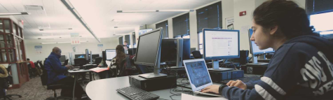 A picture of students sitting in a computer lab. 
