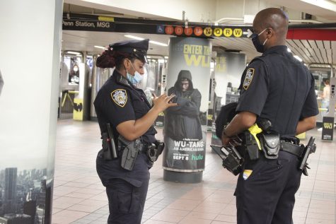 Image of subway station with police. 