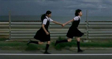 Endo and Kirishima running alongside a road near the end of the film.