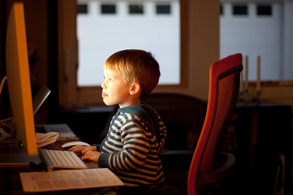 Child researching something on a computer